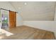 Spacious room with hardwood floors, a barn door, white ceilings and an open closet at 31 Wild Tiger Ln, Boulder, CO 80302