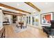 Elegant dining room featuring wood beams, fireplace, and large windows with views of the outside at 31 Wild Tiger Ln, Boulder, CO 80302