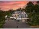 Exterior shot of home with large windows, porch, deck, and mountain view at 31 Wild Tiger Ln, Boulder, CO 80302