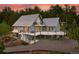 Stunning two-story home featuring a metal roof, wooden decks and a landscaped yard against a beautiful wooded setting at 31 Wild Tiger Ln, Boulder, CO 80302
