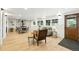 Bright living room with wood floors, stone fireplace, and natural light from the windows at 31 Wild Tiger Ln, Boulder, CO 80302
