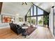 Living room with a high vaulted ceiling, decor, and windows looking out onto nature at 31 Wild Tiger Ln, Boulder, CO 80302