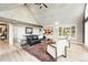 Comfortable living room with whitewashed wood-paneled walls, fireplace, and expansive windows with natural light at 31 Wild Tiger Ln, Boulder, CO 80302