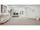 Open basement space featuring a bar with seating, neutral carpeting, and bright lighting at 1057 English Sparrow Trl, Highlands Ranch, CO 80129