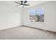 Spacious bedroom featuring a large window with bright, natural light and soft carpeting at 1057 English Sparrow Trl, Highlands Ranch, CO 80129