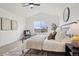 Bright bedroom featuring a ceiling fan, neutral walls, and a large window with mountain views at 1057 English Sparrow Trl, Highlands Ranch, CO 80129