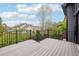 Expansive deck with black metal railings offering beautiful views of the surrounding neighborhood and landscape at 1057 English Sparrow Trl, Highlands Ranch, CO 80129