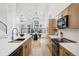 Well-appointed kitchen with modern cabinetry, stainless steel appliances, and a functional layout, enhancing the cooking experience at 1057 English Sparrow Trl, Highlands Ranch, CO 80129
