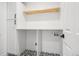 Well-organized laundry room with custom cabinetry, a convenient countertop, and modern fixtures for efficiency at 1057 English Sparrow Trl, Highlands Ranch, CO 80129
