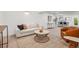 Inviting living room with a comfortable sofa, accent chair, and decorative rug creating a cozy atmosphere at 1057 English Sparrow Trl, Highlands Ranch, CO 80129