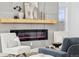 Stylish living room featuring a modern electric fireplace, accent chairs and modern decor at 1057 English Sparrow Trl, Highlands Ranch, CO 80129