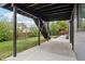 Exterior view of the covered patio and stairs leading to the upper-level deck at 1057 English Sparrow Trl, Highlands Ranch, CO 80129