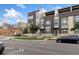 Modern townhome community with street view and landscaping at 1555 Perry St, Denver, CO 80204