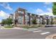 Modern townhome community with brick and neutral colors at 1555 Perry St, Denver, CO 80204