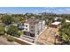 New construction showing a contemporary three-story townhome and the community's developing landscape with city views at 1372 Lowell Blvd # 2, Denver, CO 80204