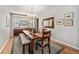 Traditional dining room featuring a wooden table, bench seating, and hardwood floors, perfect for Gathering gatherings at 10994 Shadowbrook Cir, Highlands Ranch, CO 80130