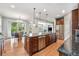 Spacious kitchen with a large island, stainless steel appliances, and hardwood floors at 10994 Shadowbrook Cir, Highlands Ranch, CO 80130