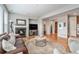 Comfortable living room with hardwood floors, fireplace, and plenty of natural light at 10994 Shadowbrook Cir, Highlands Ranch, CO 80130
