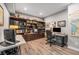 Home office with built-in bookshelves, dual desks, and ample storage, perfect for remote work at 10994 Shadowbrook Cir, Highlands Ranch, CO 80130