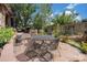 Relaxing outdoor patio with a grill, dining table, and comfortable seating at 10994 Shadowbrook Cir, Highlands Ranch, CO 80130