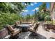 Outdoor patio with comfortable seating and a cozy fire pit at 10994 Shadowbrook Cir, Highlands Ranch, CO 80130