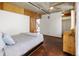 Comfortable bedroom with a modern bed, a ceiling fan, and a closet at 2340 Curtis St # 1, Denver, CO 80205