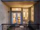 Balcony seating offers views into the unit's open floor plan featuring kitchen and dining areas at 1521 Central St # 2B, Denver, CO 80211