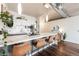 Modern kitchen features sleek white cabinets, subway tile backsplash, stainless steel appliances, and a large island with bar seating at 1521 Central St # 2B, Denver, CO 80211