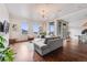 Bright living room with hardwood floors, modern furnishings, and large windows with city views at 1521 Central St # 2B, Denver, CO 80211