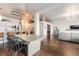 Open-concept living space with views of the modern kitchen and dining areas. Hardwood floors throughout at 1521 Central St # 2B, Denver, CO 80211