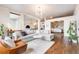 Open-concept living space with modern furnishings, view of dining area, kitchen, and bedroom at 1521 Central St # 2B, Denver, CO 80211