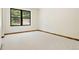 Bedroom view with carpet and wooded trim and black framed window with wooded view at 205 Loop Dr, Georgetown, CO 80444