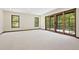 Bright bedroom with large windows and doors leading to a balcony with forest views at 205 Loop Dr, Georgetown, CO 80444