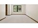 Bedroom view with carpet and wooded trim and black framed window with wooded view at 205 Loop Dr, Georgetown, CO 80444