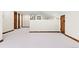 Bonus Room view with carpet and wooded trim and wood paneled door frame at 205 Loop Dr, Georgetown, CO 80444
