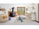 Bonus Room with fireplace, couch, view of the woods and octupus decorations at 205 Loop Dr, Georgetown, CO 80444