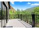 Exterior view of outdoor deck overlooking mountain view, complete with metal railing at 205 Loop Dr, Georgetown, CO 80444