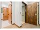 Hallway view featuring wood trim, a wooden elevator door and a wooden door off to the side at 205 Loop Dr, Georgetown, CO 80444