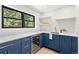 Kitchen features a wine fridge, stainless steel sink, and plenty of countertop space at 205 Loop Dr, Georgetown, CO 80444