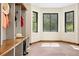 Mudroom with built-in bench, hat rack, and natural light at 205 Loop Dr, Georgetown, CO 80444