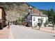 Quaint street view featuring a bell tower and storefronts, set against a mountain backdrop at 205 Loop Dr, Georgetown, CO 80444