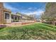 Exterior shot of large deck and landscaped backyard with mature trees at 6376 S Pierson St, Littleton, CO 80127