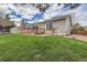 Exterior of home showing large deck, lush lawn, and convenient backyard access at 6376 S Pierson St, Littleton, CO 80127