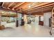 Unfinished basement with exposed wood ceiling and room for storage at 6376 S Pierson St, Littleton, CO 80127
