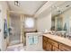 Traditional bathroom with neutral tones, glass shower and functional vanity area at 6376 S Pierson St, Littleton, CO 80127