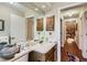 Bathroom offers ample counter space, wood cabinets and decorative interior at 6376 S Pierson St, Littleton, CO 80127