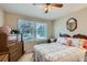 Bedroom featuring natural light, warm tones and a view of the outside landscape at 6376 S Pierson St, Littleton, CO 80127
