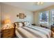 Bedroom provides a serene space with views and traditional furnishings at 6376 S Pierson St, Littleton, CO 80127