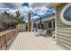 Spacious deck with awning, shed, chimney, and backyard views for entertaining at 6376 S Pierson St, Littleton, CO 80127