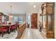 Inviting foyer featuring tile and wood floors, with views of the adjacent dining area at 6376 S Pierson St, Littleton, CO 80127